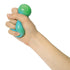 Hand squeezing blue and green Crush It! super sensory ball for tactile play — Adventure Awaits