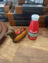 Hot dog dachshund and ketchup novelty salt and pepper shakers on shop shelf — Adventure Awaits