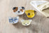 Dog ceramic measuring cups on wooden bench with tea towel — Adventure Awaits