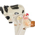 Close-up of ceramic cow, pig, sheep and rooster measuring spoons with hand-painted details — Adventure Awaits