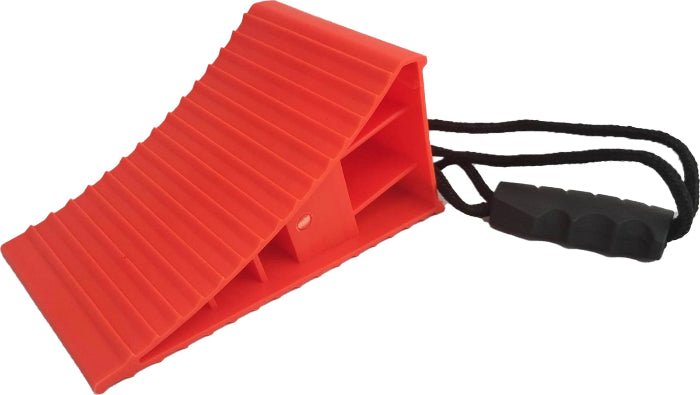 Red wheel chock with ribbed ramp surface and black pull handle side view — Adventure Awaits