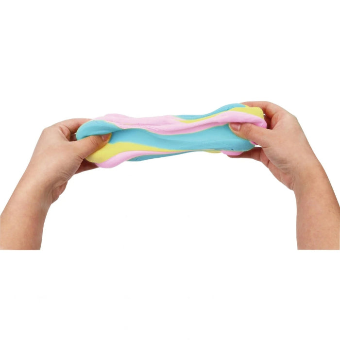hands stretching pastel buttery putty in pink blue and yellow, soft stretchy sensory slime for kids play and stress relief Adventure Awaits