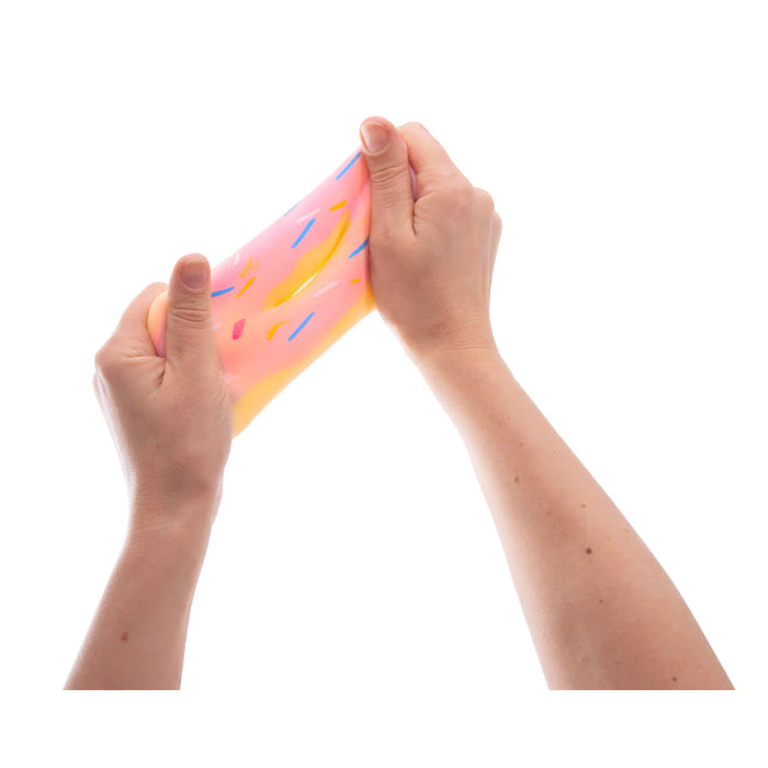 Hands stretching pink donut squeeze toy with sprinkles, soft sensory fidget toy for kids stress relief and calming play Adventure Awaits