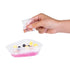 Hand adding toppings to Pizza Slime DIY sensory toy with pink slime tray — Adventure Awaits