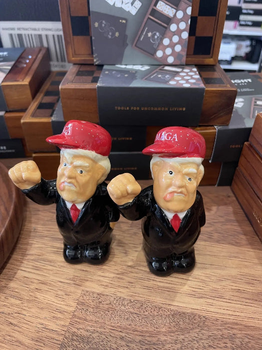 Presidential caricature salt and pepper shakers with red caps on shop shelf — Adventure Awaits
