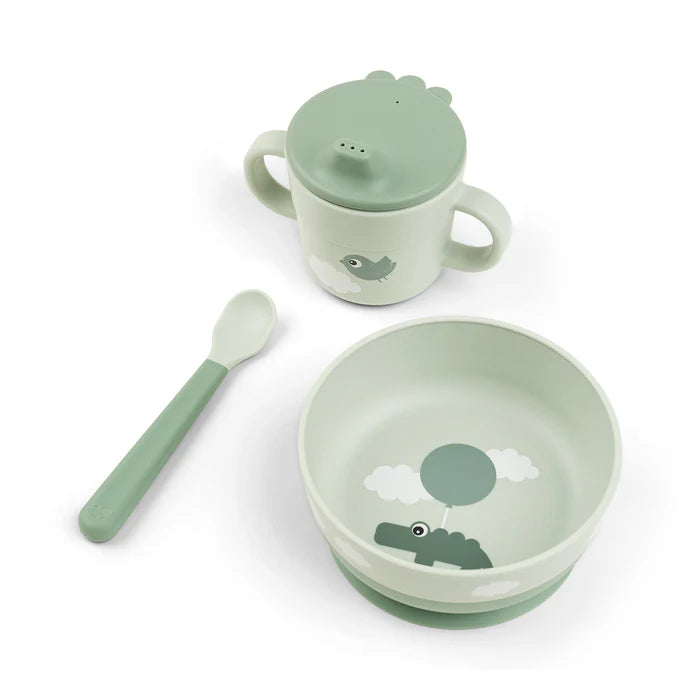 Baby feeding set with suction bowl, spoon and handled cup with lid in soft green tones, ideal for mess free meals at home or travel Adventure Awaits