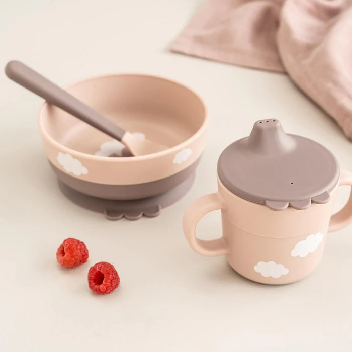 Baby feeding set with suction bowl, spoon and handled cup with lid on table, ideal for easy mess free mealtimes at home or travel Adventure Awaits