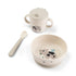 Baby feeding set with suction bowl, spoon and handled cup with lid in neutral tones featuring cow design, ideal for mess free meals at home or travel Adventure Awaits