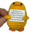 handmade crochet duck plush toy holding a funny sign about not having ducks in a row
