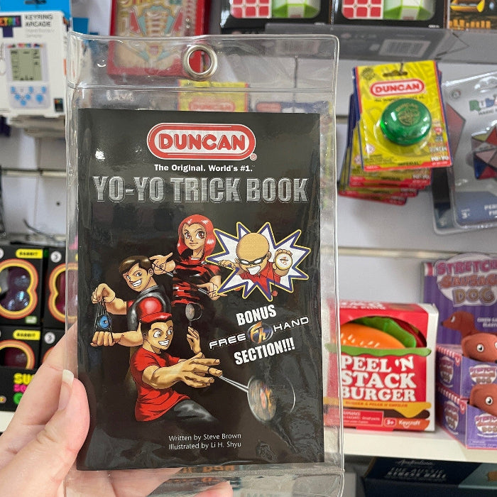 Duncan yo-yo trick book in retail packaging, illustrated guide for learning yo-yo skills and tricks, perfect for classic play at home or travel Adventure Awaits