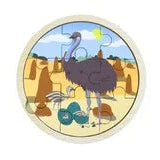 A circular wooden puzzle featuring a cartoon ostrich in a desert landscape with emu under a blue sky, set against a plain white background.