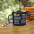 Survival Guide enamel mug with carabiner handle on wooden table, printed outdoor tips design for camping and adventure use Adventure Awaits
