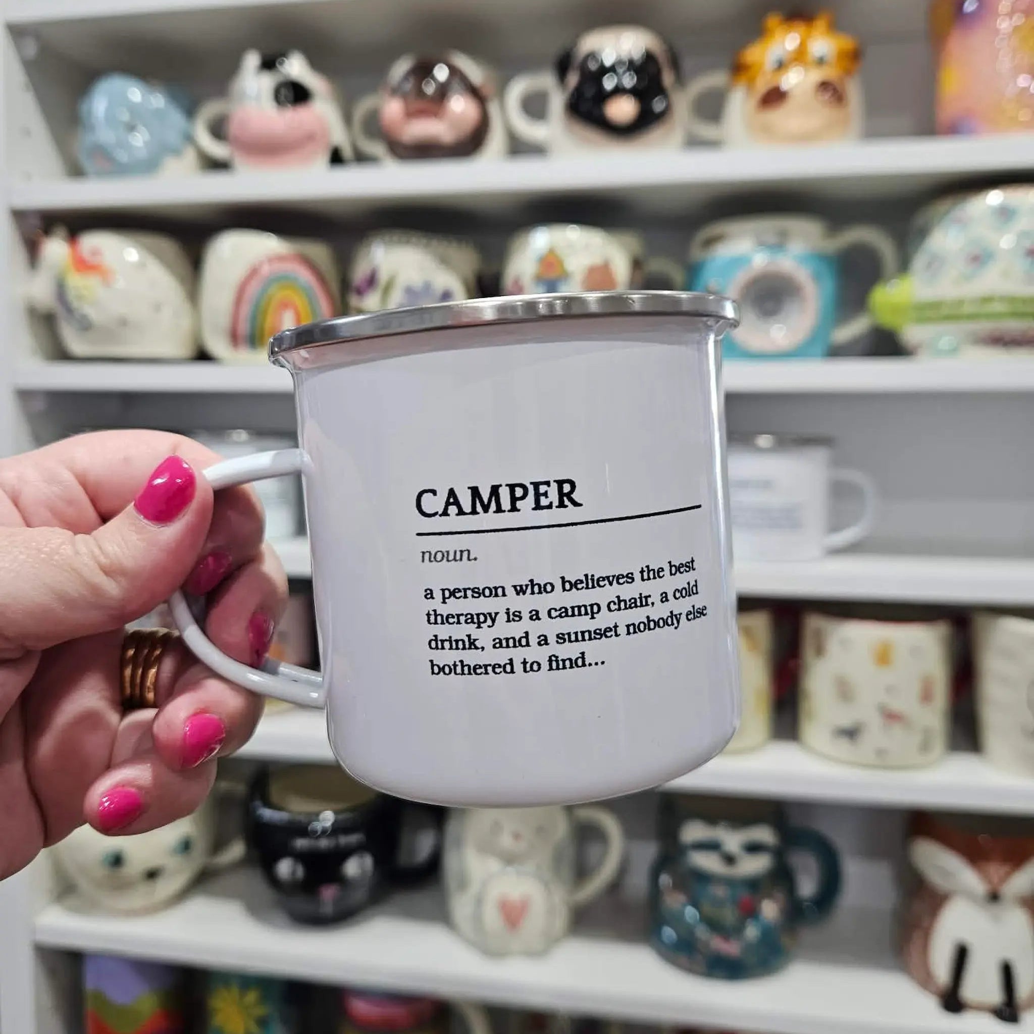 Hand holding a "Camper" definition enamel mug in the Adventure Awaits gift shop, Numurkah Victoria — Adventure Awaits