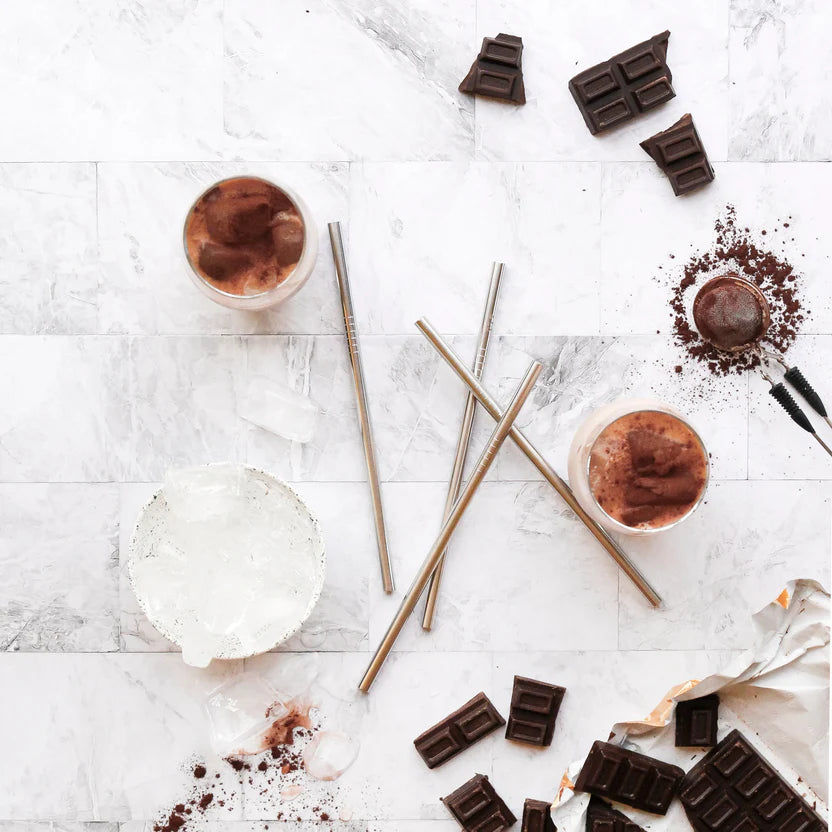 Ever Eco stainless steel smoothie straws beside chocolate drinks on marble bench — Adventure Awaits
