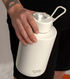 Hand holding cloud Frank Green bottle with flip straw lid and carry strap — Adventure Awaits