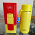 Yellow thermos with 'frank Green branding next to a red box on a white surface.