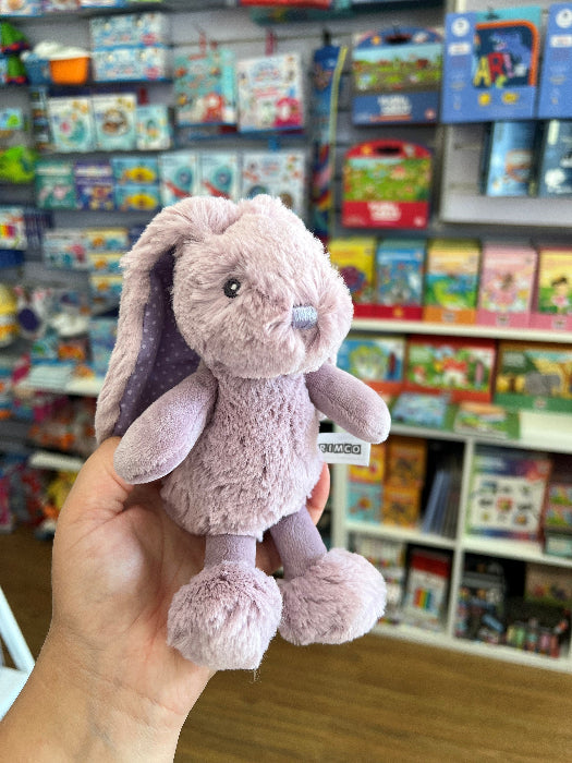 lilac spotty frankie bunny in hand with store in background