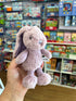 lilac spotty frankie bunny in hand with store in background