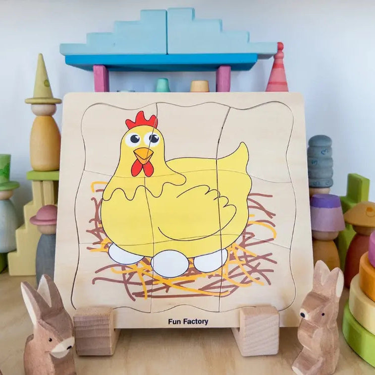 Fun Factory wooden chicken puzzle with hen and eggs surrounded by colourful wooden toys — Adventure Awaits