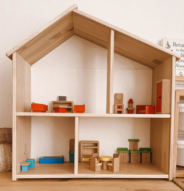 Wooden dollhouse furnished with colourful bedroom, kitchen, bathroom and lounge pieces — Adventure Awaits