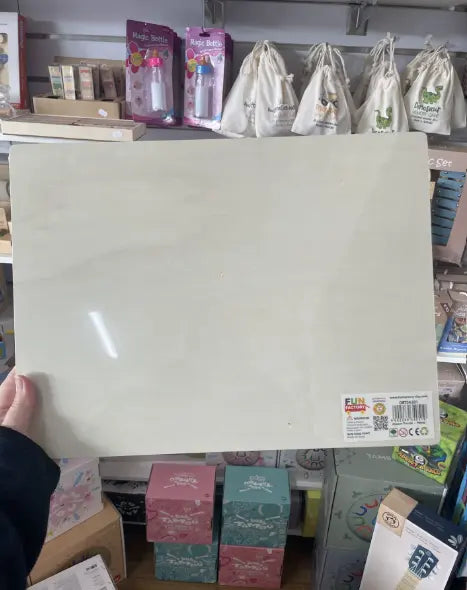 Back of Fun Factory wooden horse jigsaw puzzle board held in store — Adventure Awaits