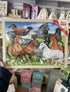 Fun Factory wooden horse jigsaw puzzle held in store with running horses — Adventure Awaits