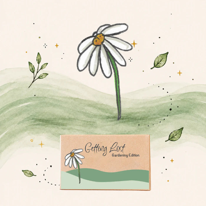 Getting Lost Gardening Edition card game box with illustrated white daisy and green garden scene, Adventure Awaits