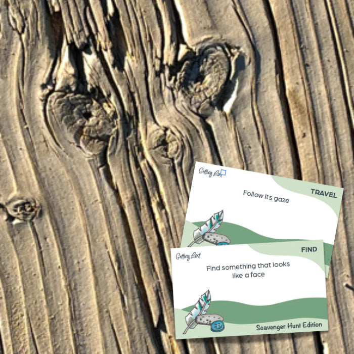 Scavenger Hunt Edition cards on weathered timber finding a face in the wood grain — Adventure Awaits
