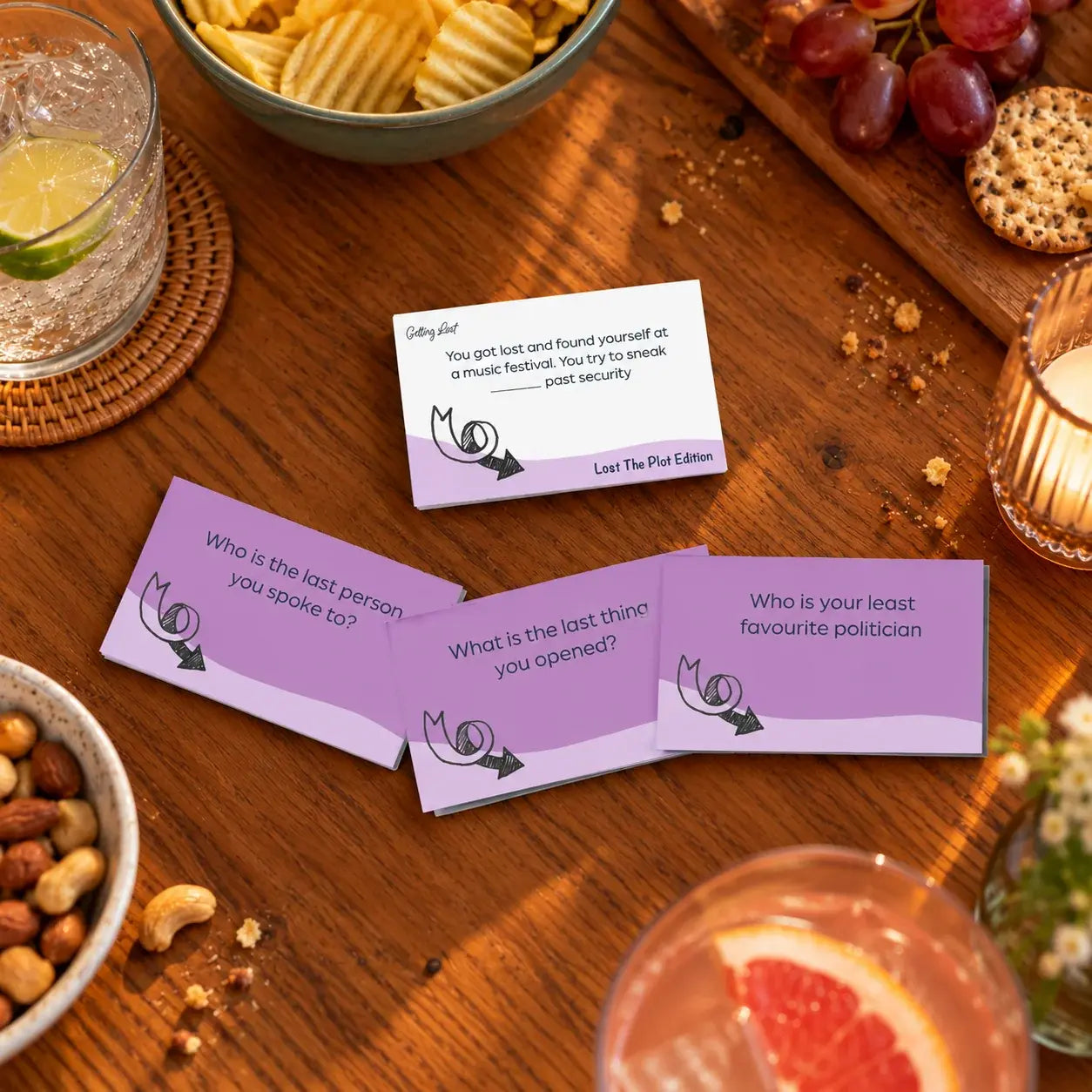 Getting Lost Lost The Plot Edition party game cards with funny question prompts on a table — Adventure Awaits