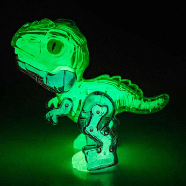 Green light-up dinosaur robot toy glowing in the dark for kids sensory play — Adventure Awaits