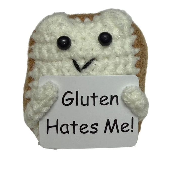 handmade crochet toast plush toy holding a humorous “Gluten Hates Me!” quote sign