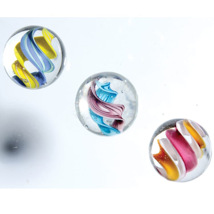 Clear glass marbles with blue and yellow double helix,  blue and purple double helix and pink, white and orange double helix — Adventure Awaits