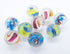 Eight clear glass marbles with colourful twisted swirls in blue, green, pink, orange and purple — Adventure Awaits