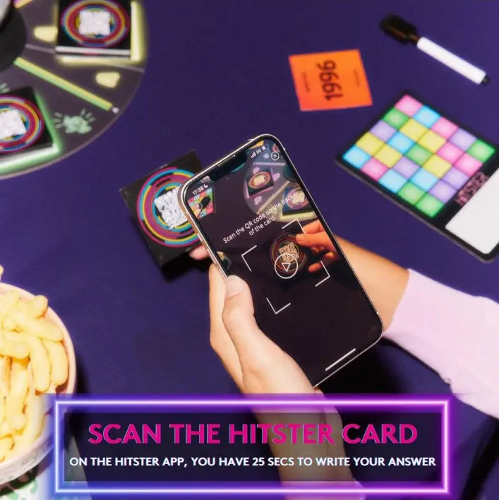 Player scanning a HITSTER Music Bingo card with the app to start the song — Adventure Awaits