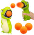 Green dinosaur popper toy with orange foam balls for kids active play — Adventure Awaits