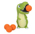 Green T-Rex Popper toy with orange foam balls for kids active play — Adventure Awaits