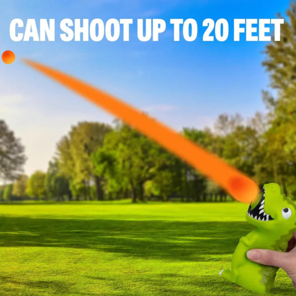 Dinosaur popper toy shooting orange foam ball across park grass for kids active play — Adventure Awaits