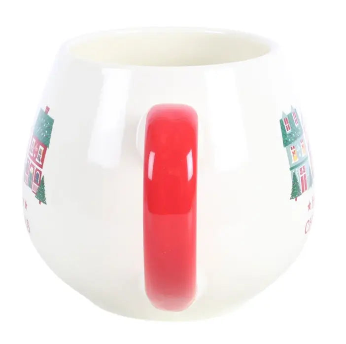 Side view of Home for Christmas ceramic mug with glossy red handle and festive house design — Adventure Awaits