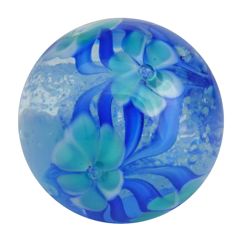 Clear blue glass marble with aqua floral swirls and textured bubbles inside — Adventure Awaits