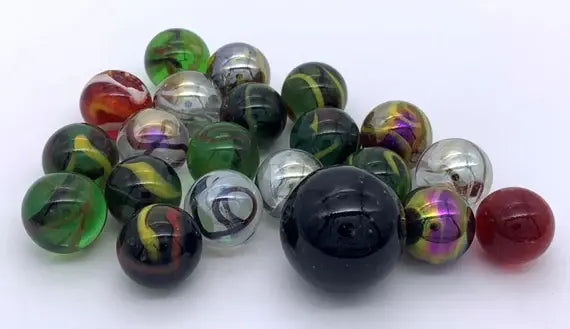 Assorted glass marbles in green, black, clear, red and multicoloured swirl designs — Adventure Awaits