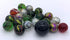 Assorted glass marbles in green, black, clear, red and multicoloured swirl designs — Adventure Awaits