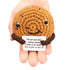 hand holding a handmade crochet cookie plush toy with a funny sign about cookies and happiness