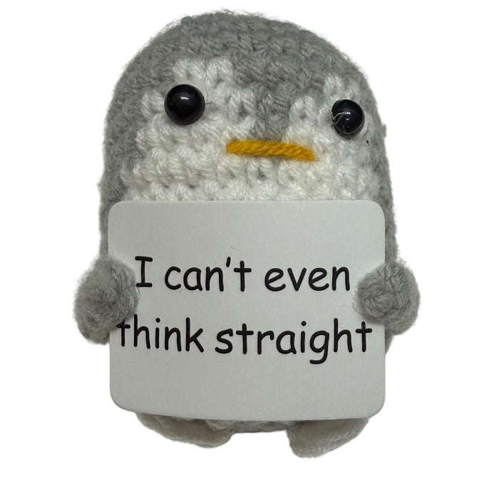 handmade crochet penguin plush toy holding a funny “I can’t even think straight” quote sign