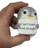 hand holding a handmade crochet penguin plush toy with a funny “I can’t even think straight” sign