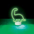 Green diplodocus dinosaur neon light glowing on tabletop — Adventure Awaits