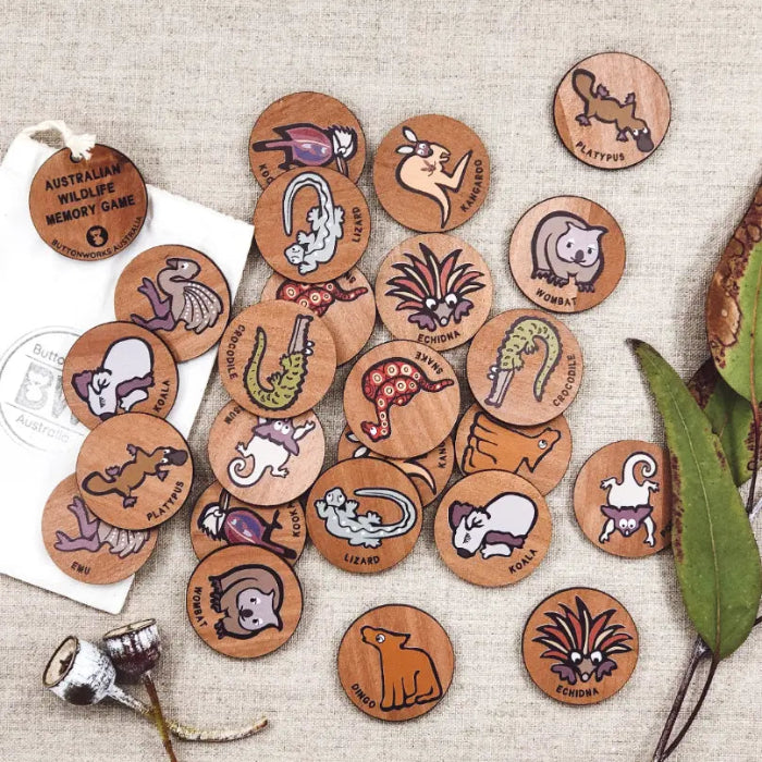 Australian wildlife memory game with round wooden animal pieces including koala, wombat, platypus and echidna — Adventure Awaits