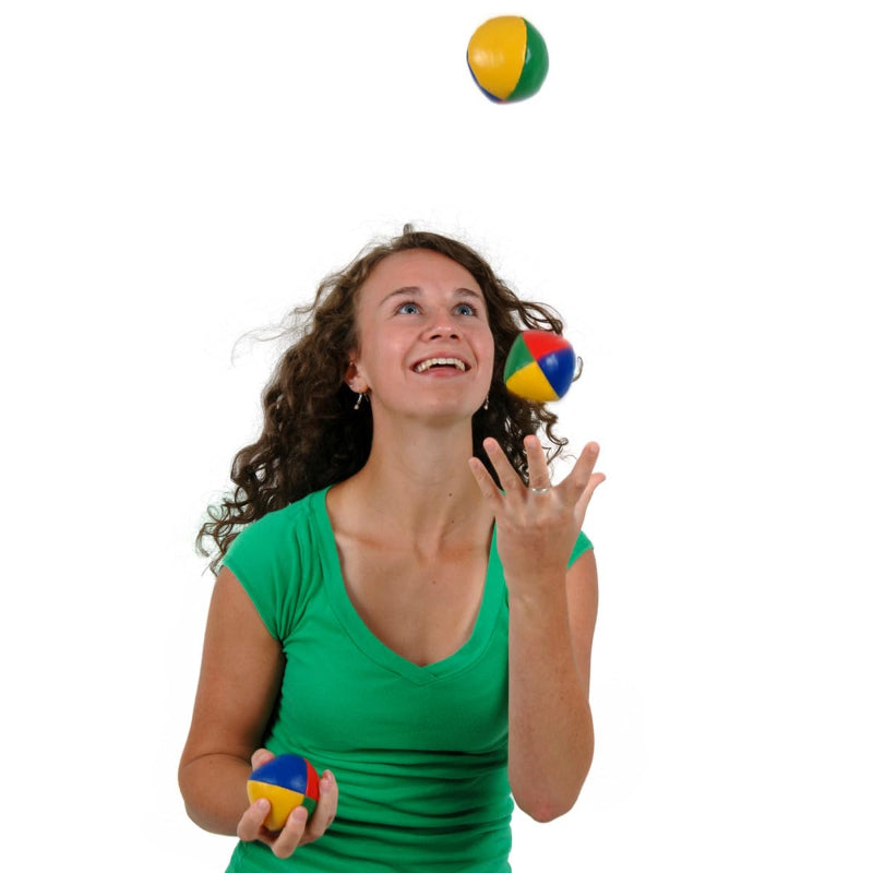Woman juggling colorful balls on a white background
