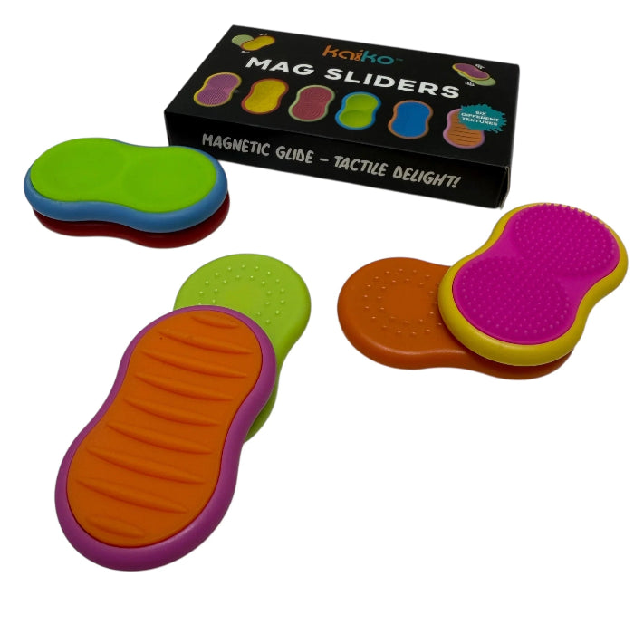 Colourful Kaiko Mag Sliders paired and stacked beside the storage box — Adventure Awaits