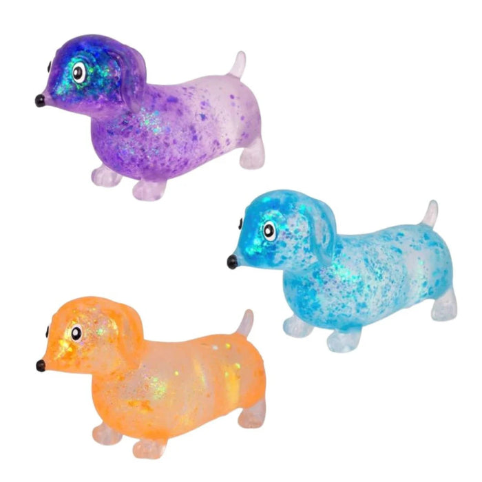 Glitter dachshund sensory toys in purple, blue and orange with translucent squishy bodies — Adventure Awaits