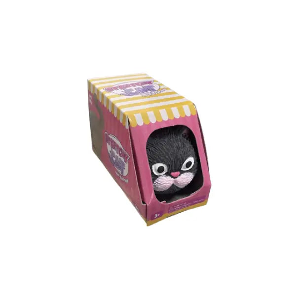 Black Stretchy Cat toy peeking out of pink striped box — Adventure Awaits